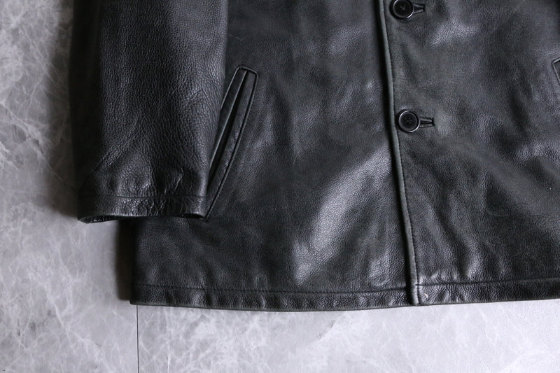 black leather middle length jacket