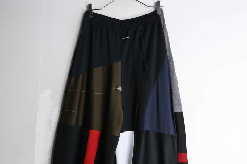 "Re:make" asymmetry patchwork HAKAMA track pants