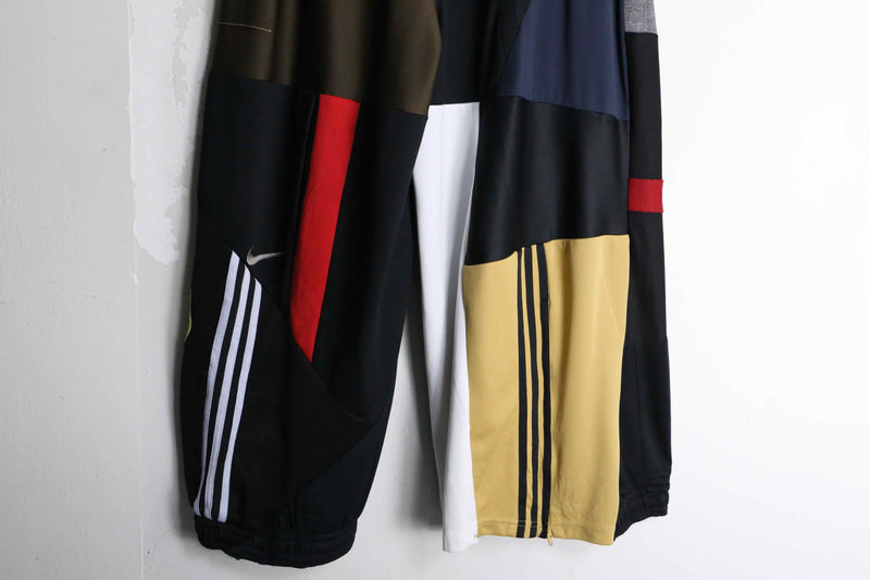 "Re:make" asymmetry patchwork HAKAMA track pants