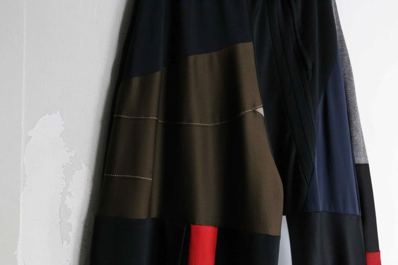 "Re:make" asymmetry patchwork HAKAMA track pants