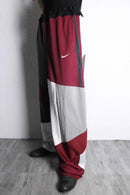 "Re:make" asymmetry docking HAKAMA track pants