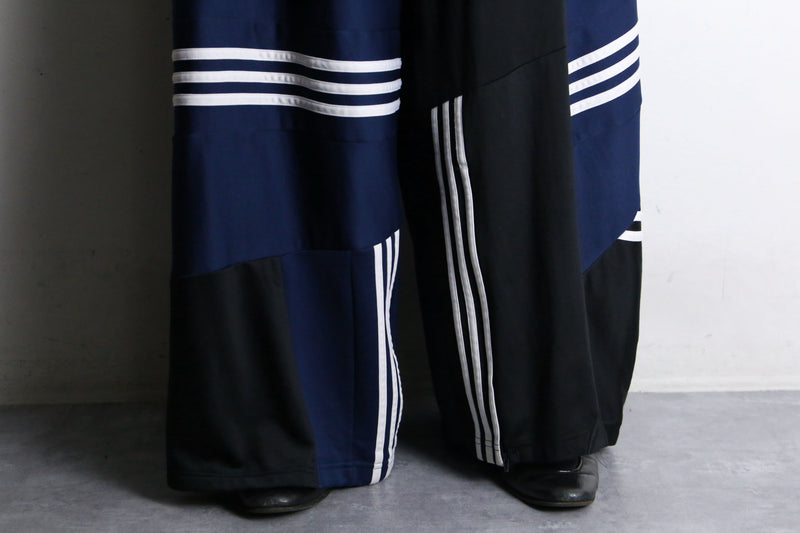 "Re:make" asymmetry patchwork HAKAMA track pants