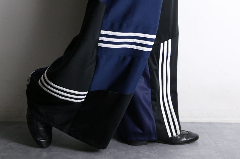 "Re:make" asymmetry patchwork HAKAMA track pants