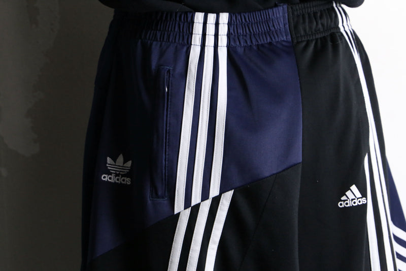 "Re:make" asymmetry patchwork HAKAMA track pants