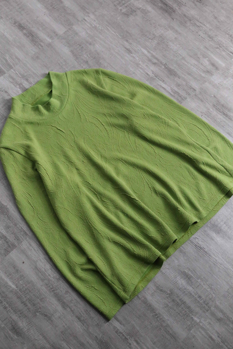green botanical like wrinkled off neck knit