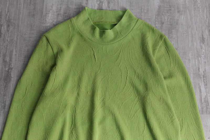 green botanical like wrinkled off neck knit