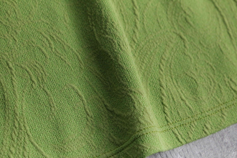 green botanical like wrinkled off neck knit