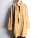 botanical embroidery over coat