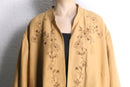 botanical embroidery over coat