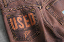 faded brown logo design denim pants