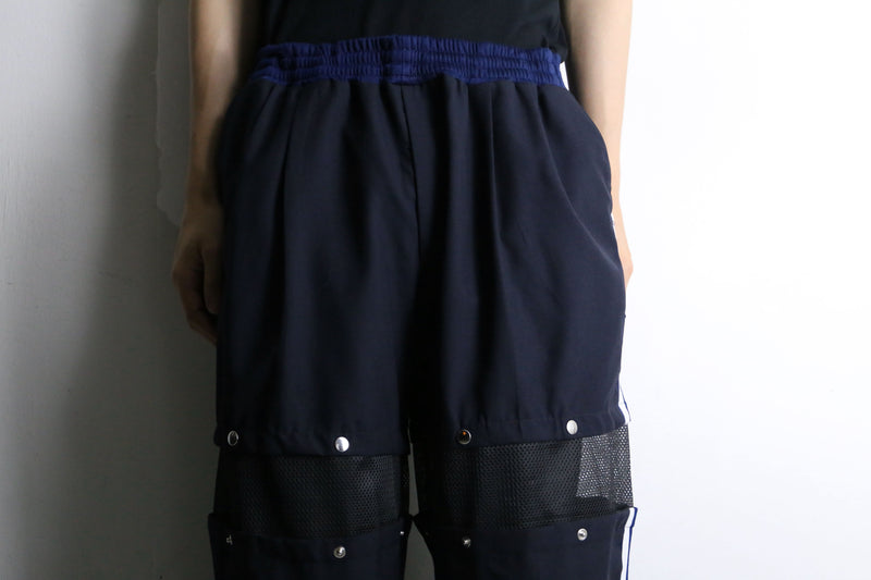 "Re:make" track × slacks layered mesh pants