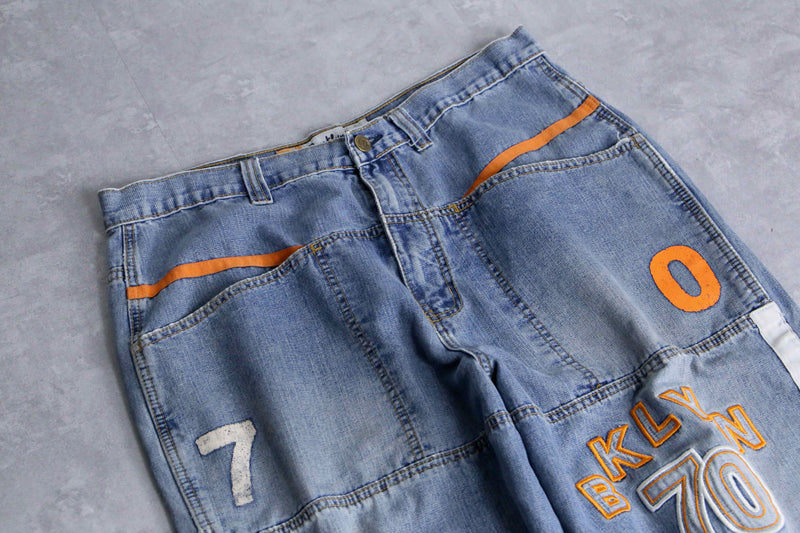 light blue × orange piping design wide denim pants