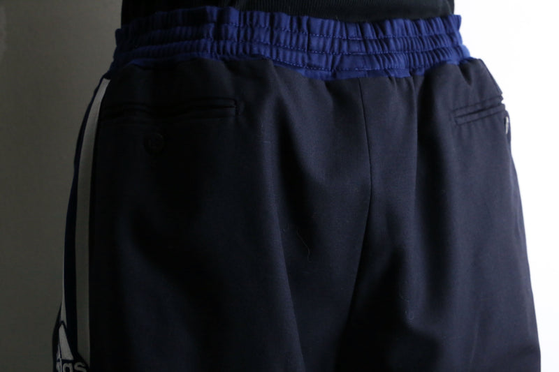 "Re:make" track × slacks layered mesh pants