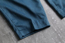 blue poly gabardine pleated slacks