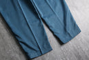 blue poly gabardine pleated slacks