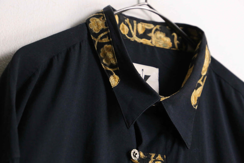 gold flower collar black drape shirt