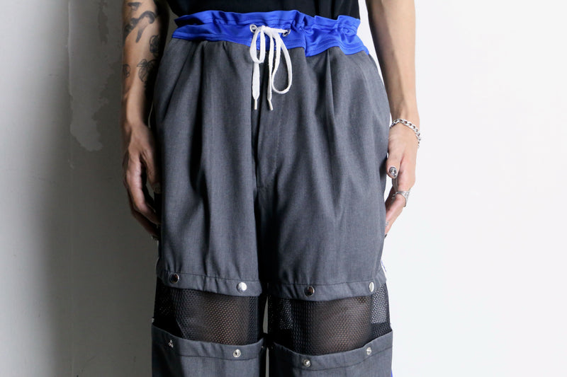 "Re:make" track × slacks layered mesh pants