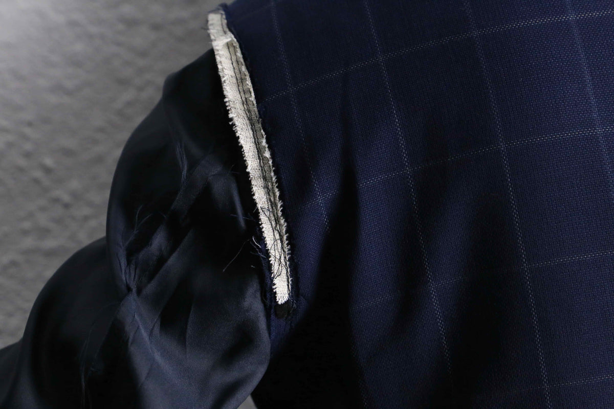 Re:make” button art stitch docking tailored jacket