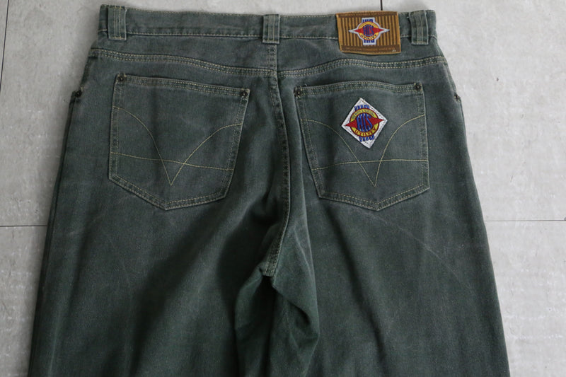 fade green wide tapered silhouette denim