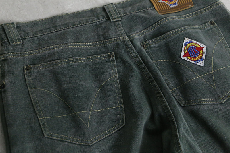 fade green wide tapered silhouette denim