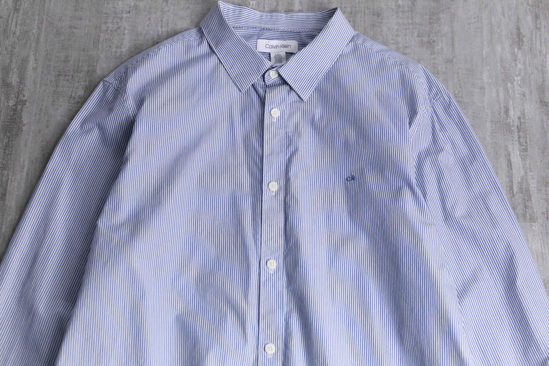 “Calvin Klein” blue stripe shirt