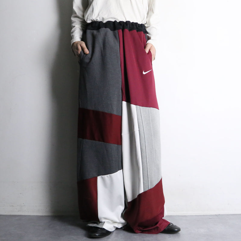 "Re:make" asymmetry docking HAKAMA track pants