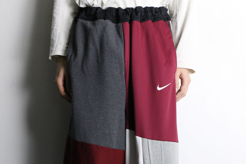 "Re:make" asymmetry docking HAKAMA track pants