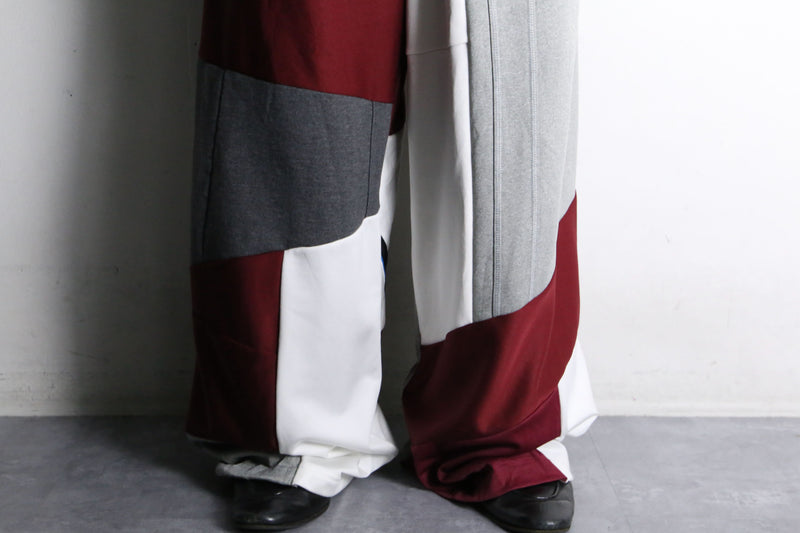 "Re:make" asymmetry docking HAKAMA track pants