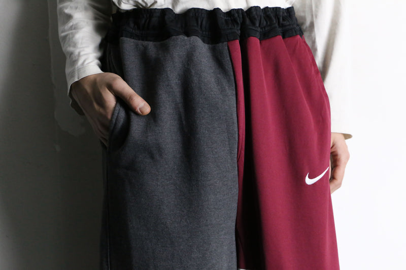 "Re:make" asymmetry docking HAKAMA track pants