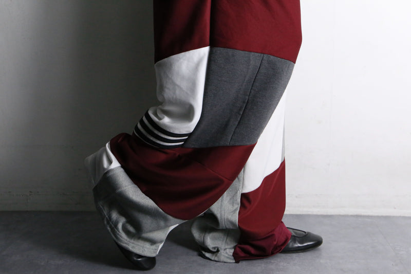 "Re:make" asymmetry docking HAKAMA track pants