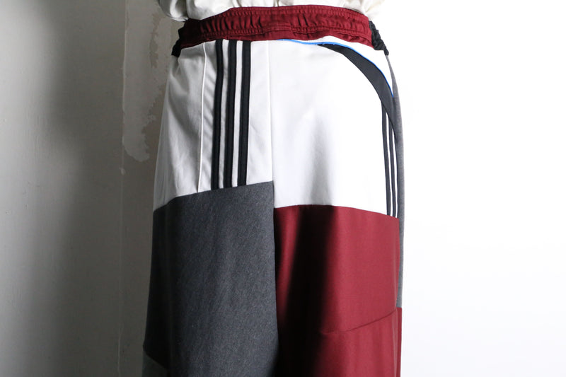 "Re:make" asymmetry docking HAKAMA track pants