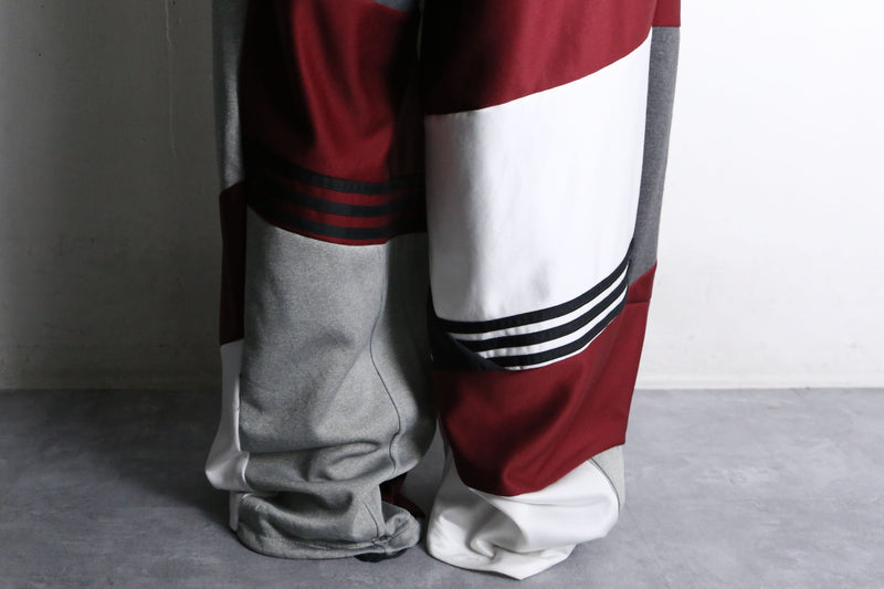 "Re:make" asymmetry docking HAKAMA track pants