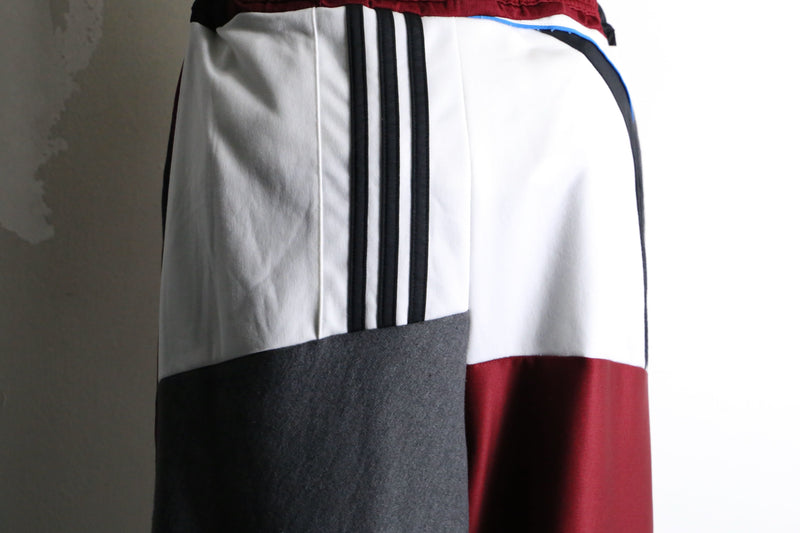 "Re:make" asymmetry docking HAKAMA track pants