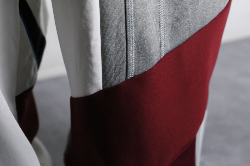 "Re:make" asymmetry docking HAKAMA track pants