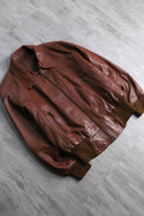 brown wide-collar leather bomber jacket