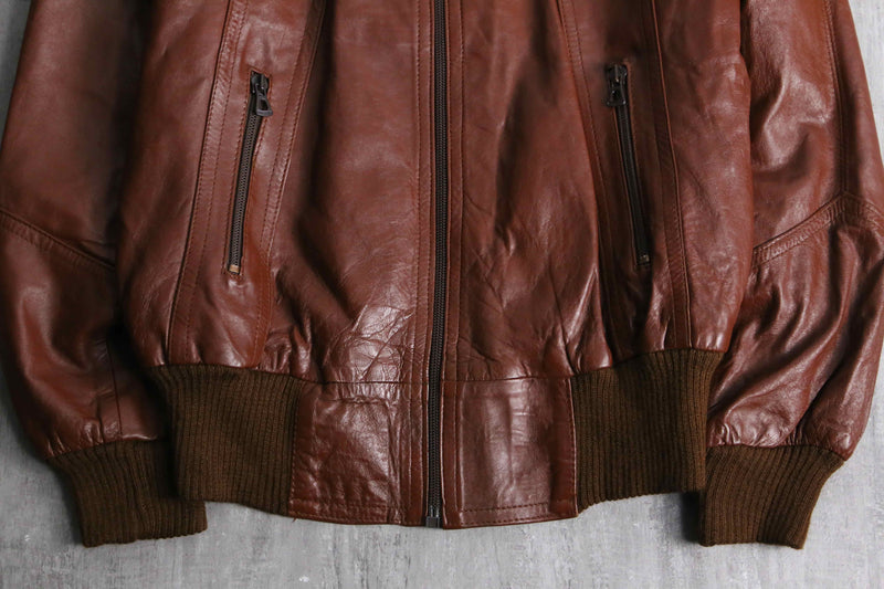 brown wide-collar leather bomber jacket