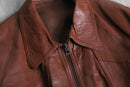 brown wide-collar leather bomber jacket