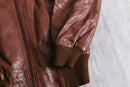 brown wide-collar leather bomber jacket