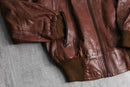 brown wide-collar leather bomber jacket
