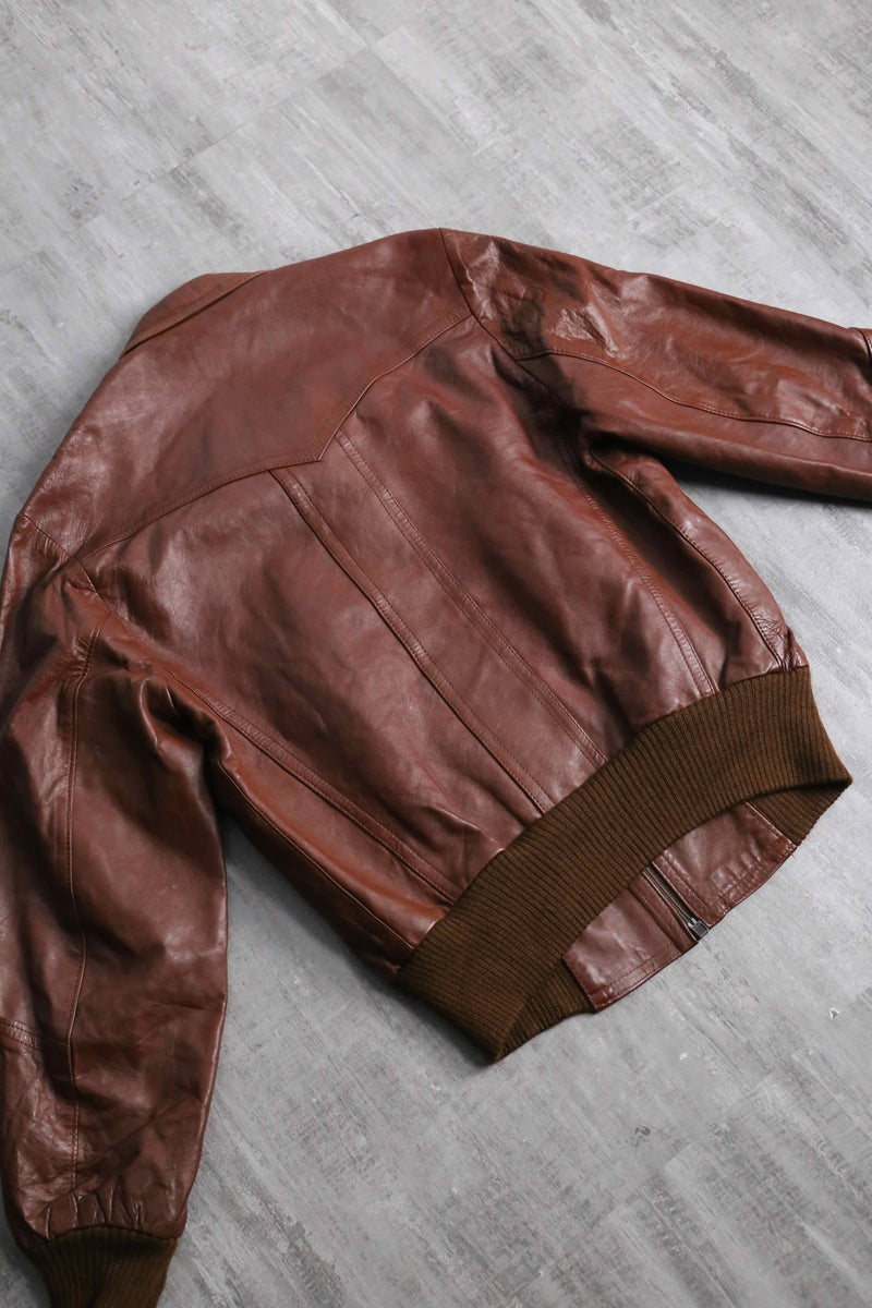 brown wide-collar leather bomber jacket