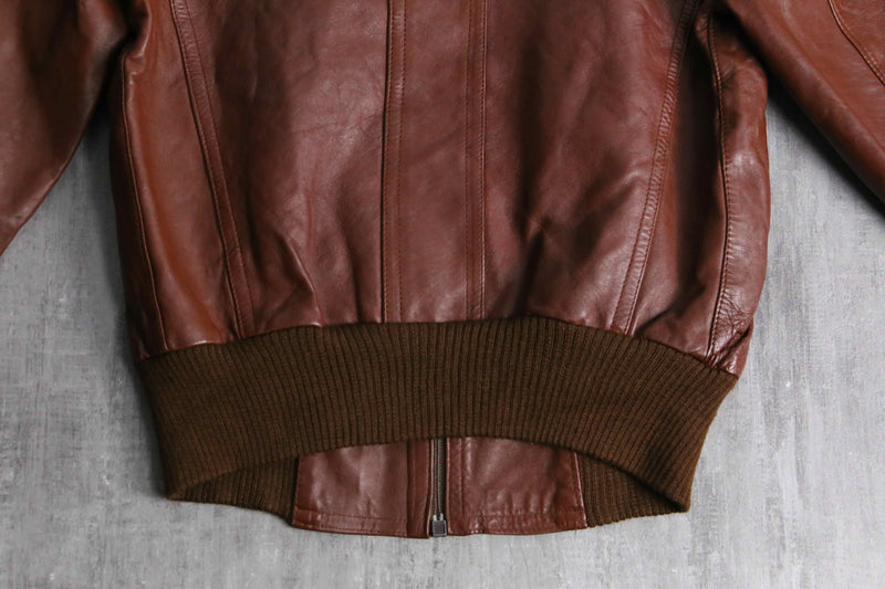 brown wide-collar leather bomber jacket