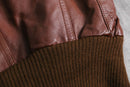 brown wide-collar leather bomber jacket