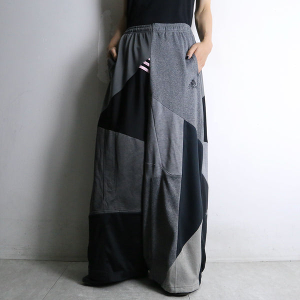 "Re:make" asymmetry docking HAKAMA track pants