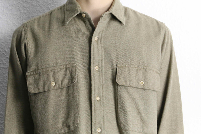 “Calvin Klein” khaki color work motif shirt