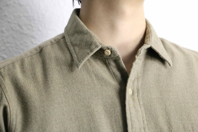 “Calvin Klein” khaki color work motif shirt
