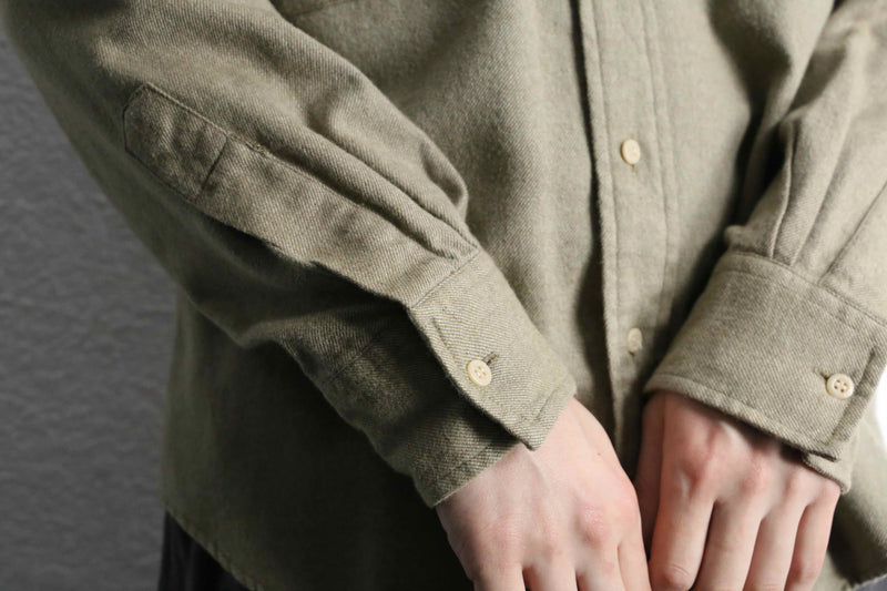 “Calvin Klein” khaki color work motif shirt
