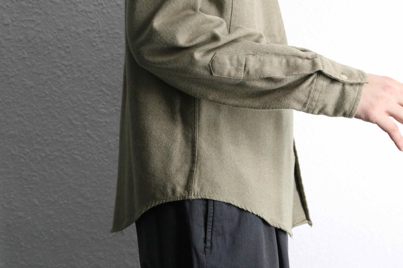“Calvin Klein” khaki color work motif shirt
