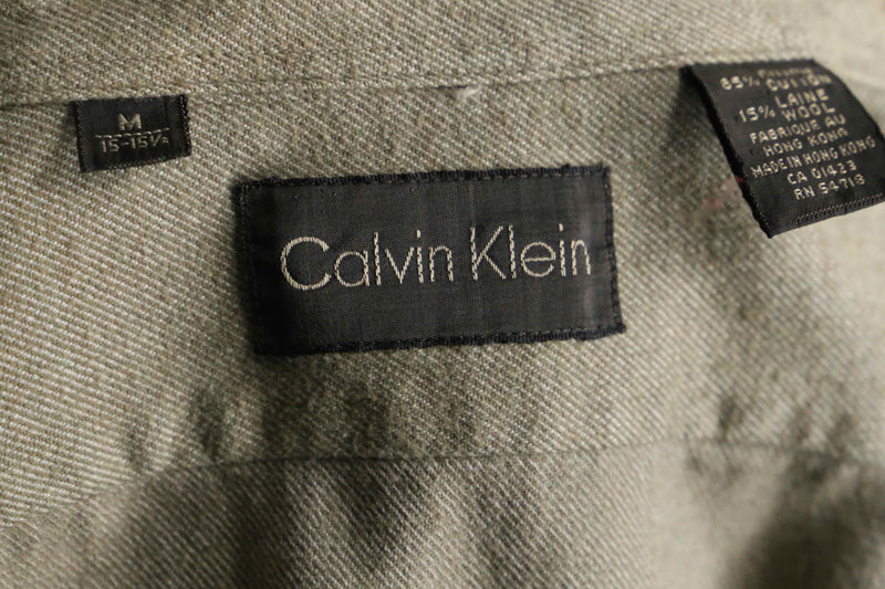 “Calvin Klein” khaki color work motif shirt