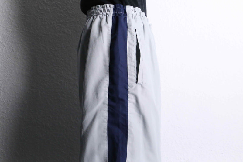 “FILA” navy×gray color track pants