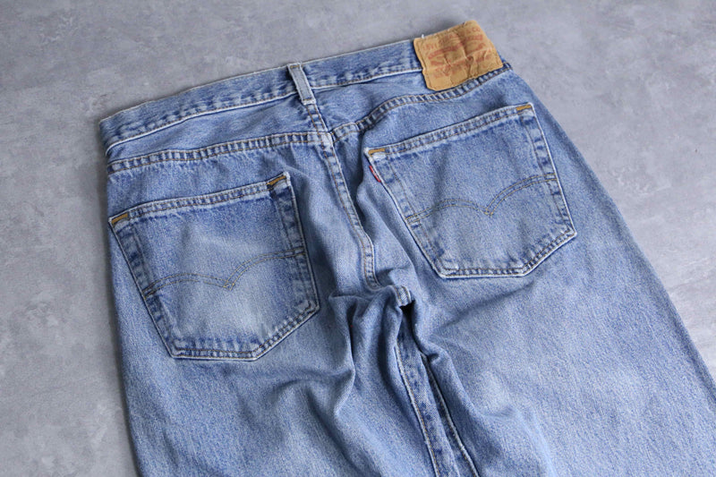 "Re:make" tuck & patch design buggy denim pants